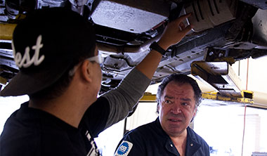 men repairing car image